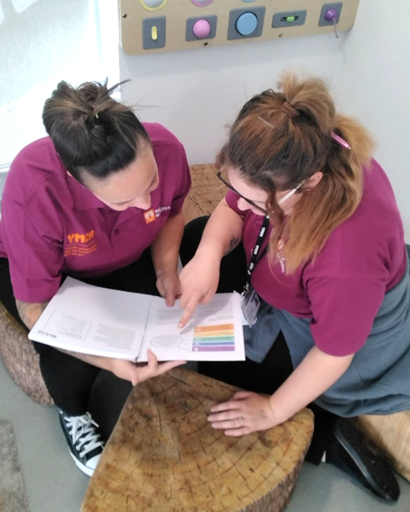 YMCA Nursery practitioners discussing how they can embed thrive training into daily nursery life.
