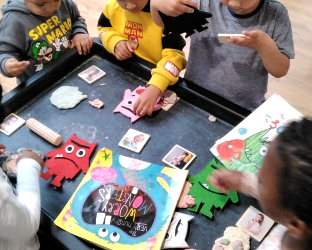 Nursery practitioners working with children at YMCA day nursery in line with new Thrive training
